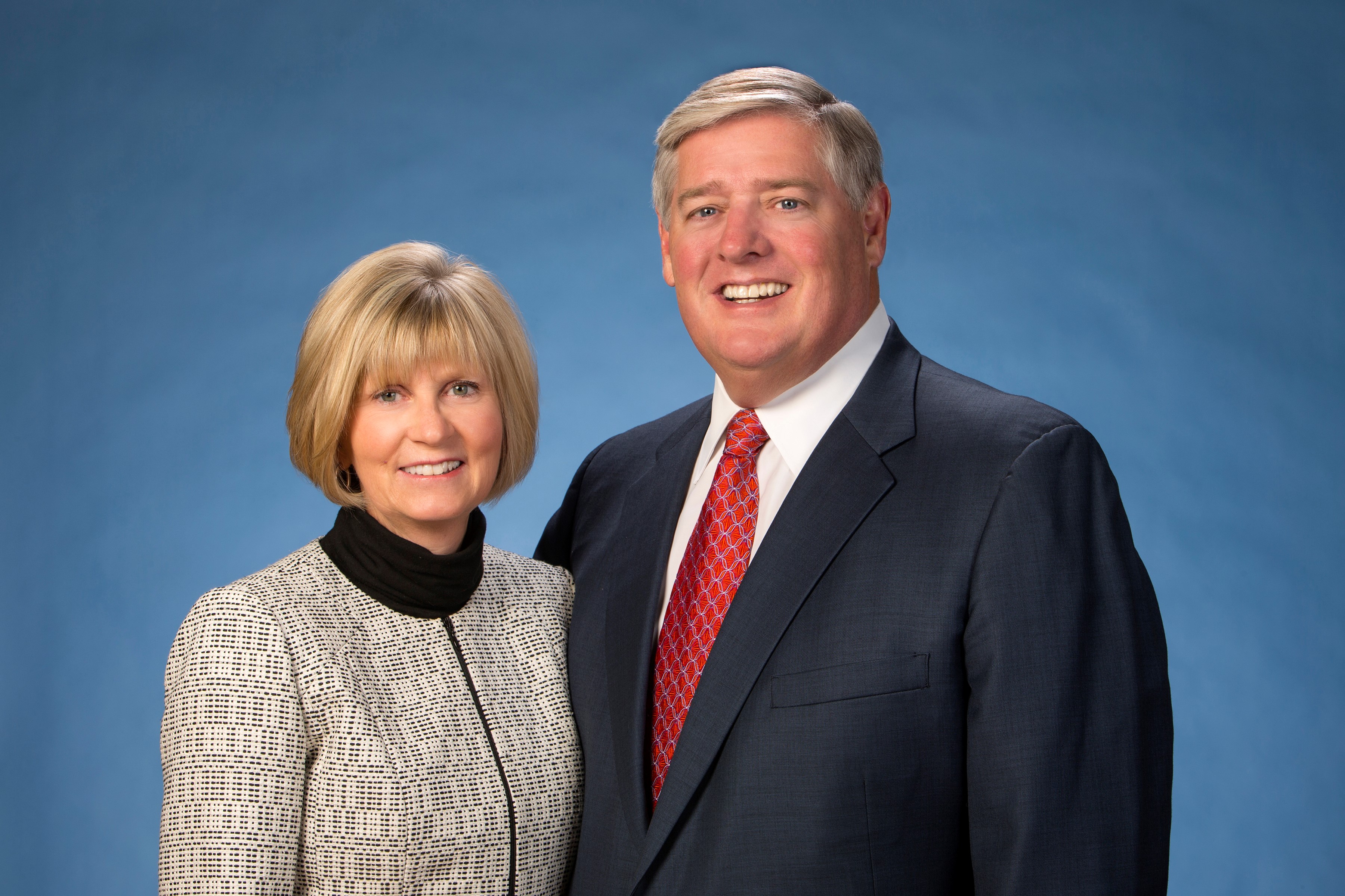 John and Carrie Hayden against blue background