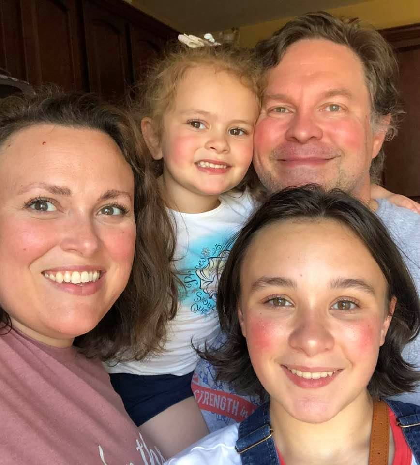 Four people smiling