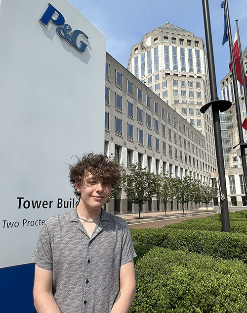 Treavor Nealy standing in front of P&G building.