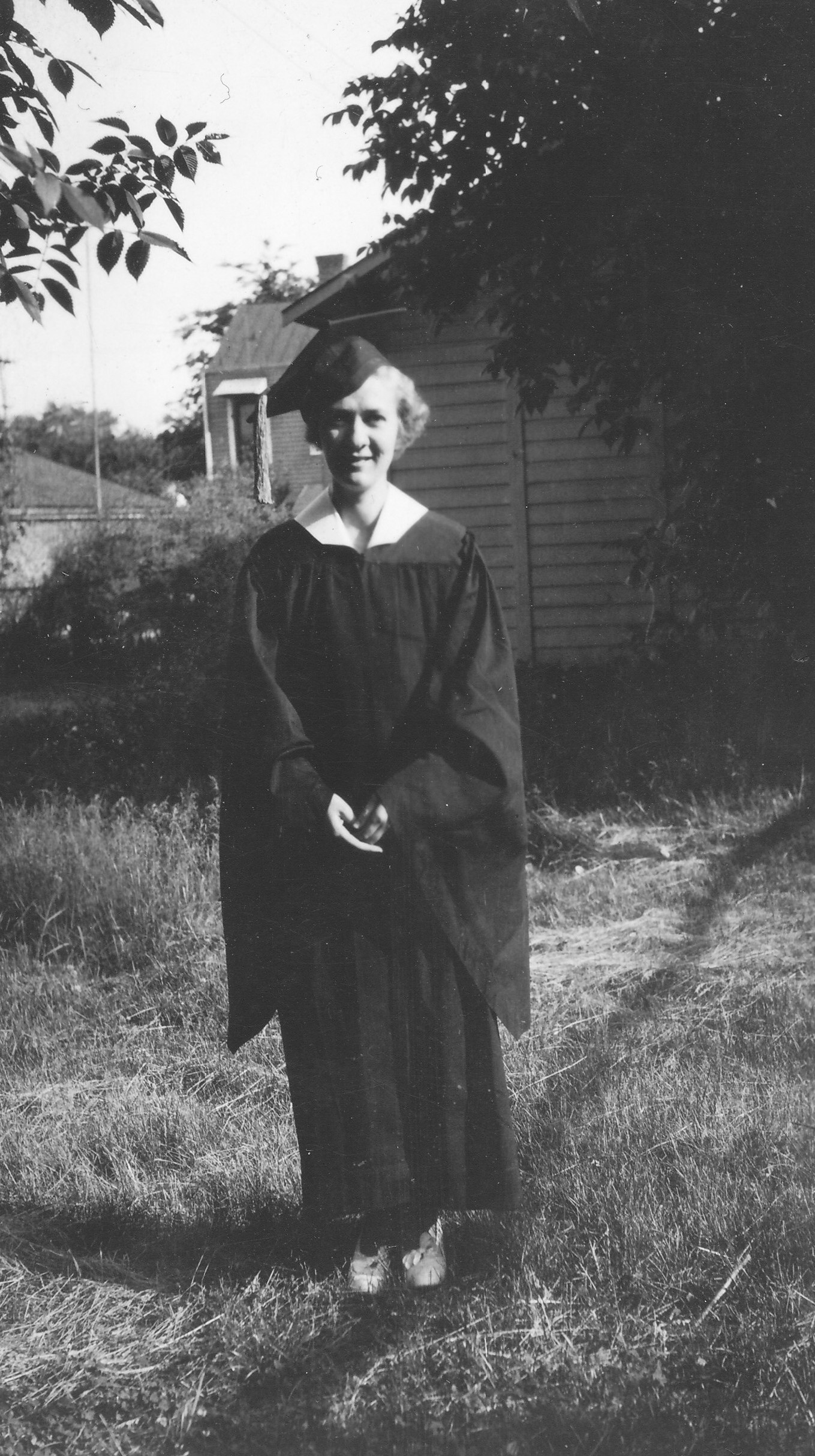 Black and white portrait of Norma Wellman Cobb in cap and gown.