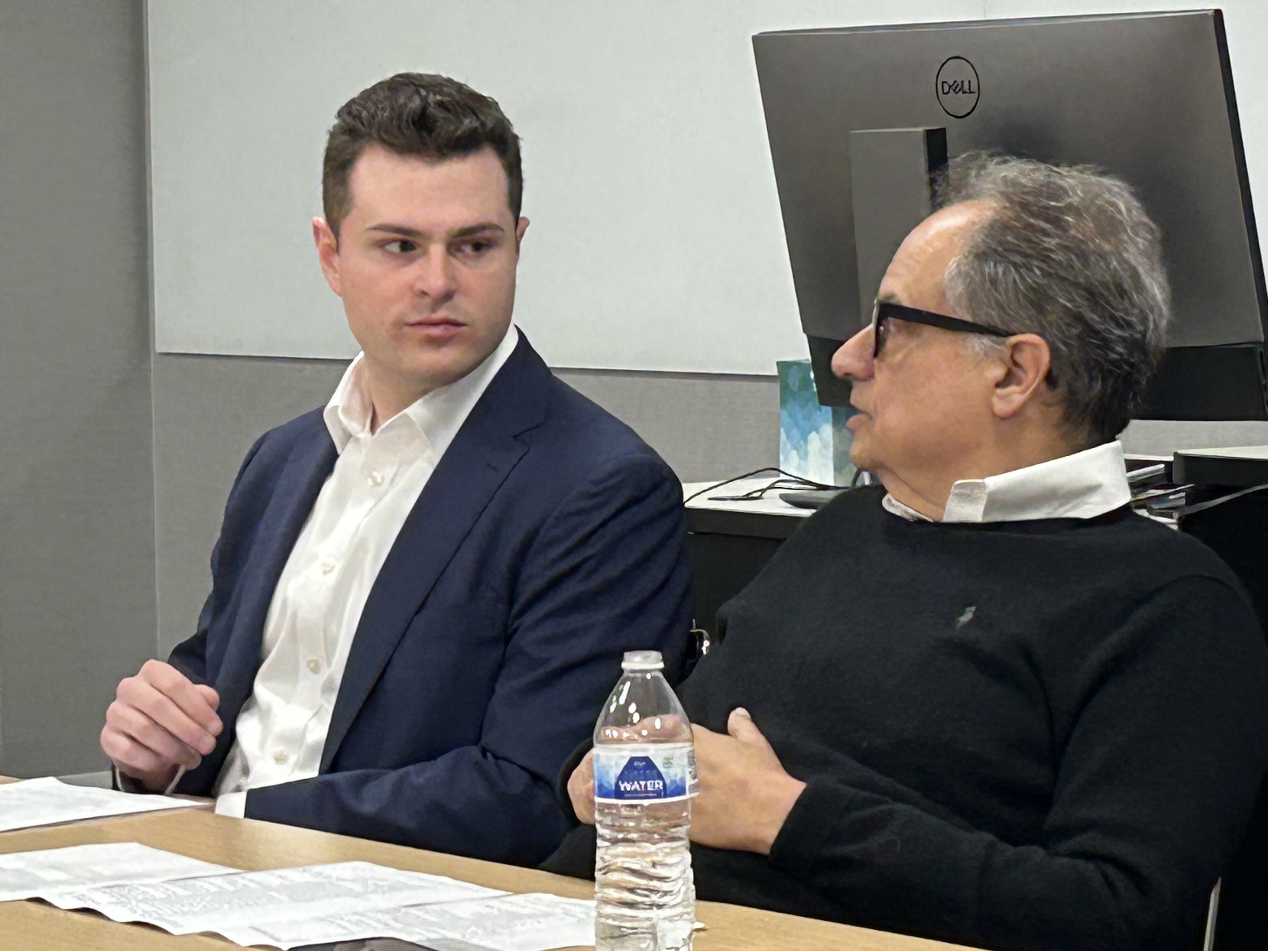 Two men talking.