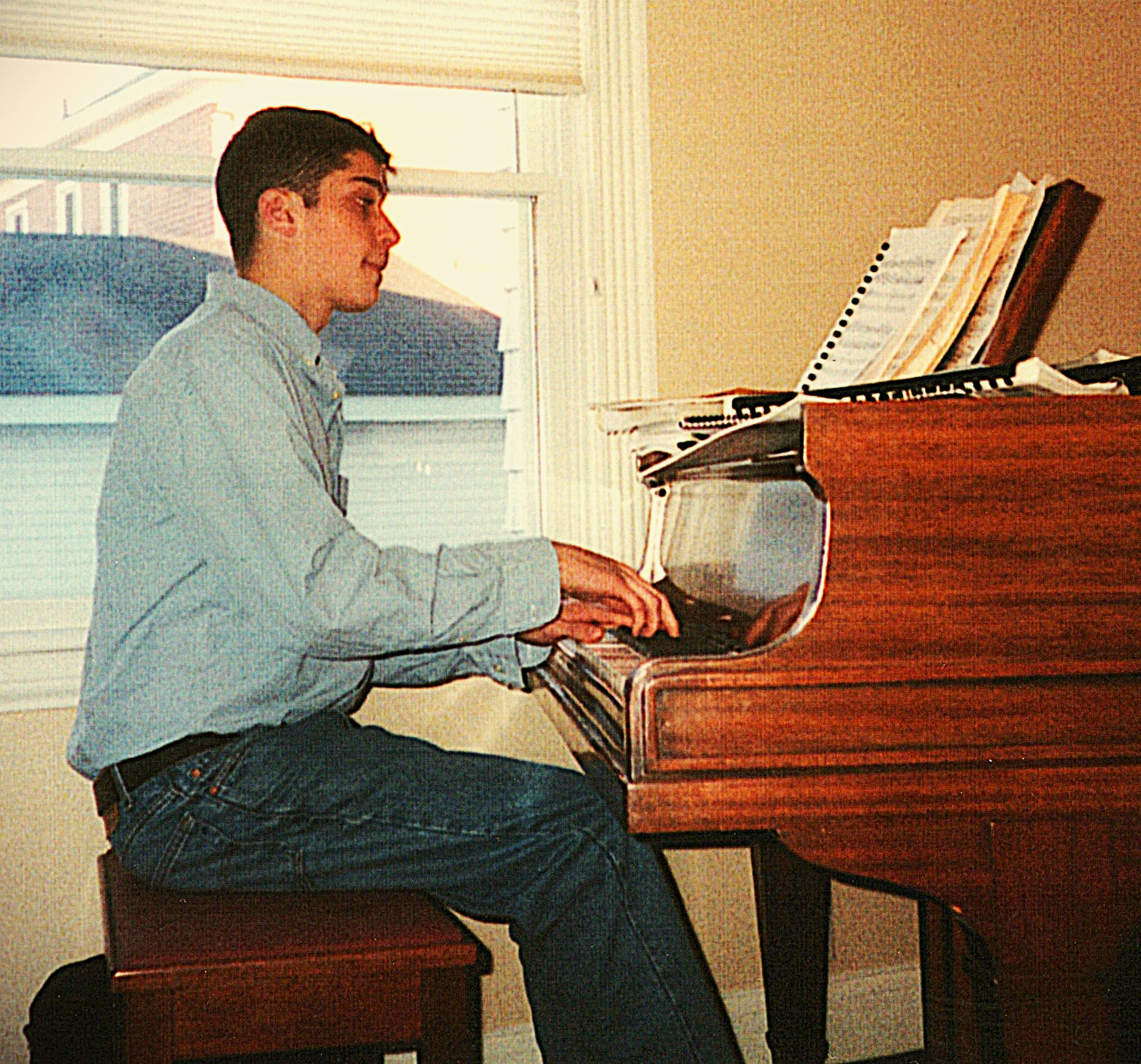 Ben Carlson-Berne playing the piano.