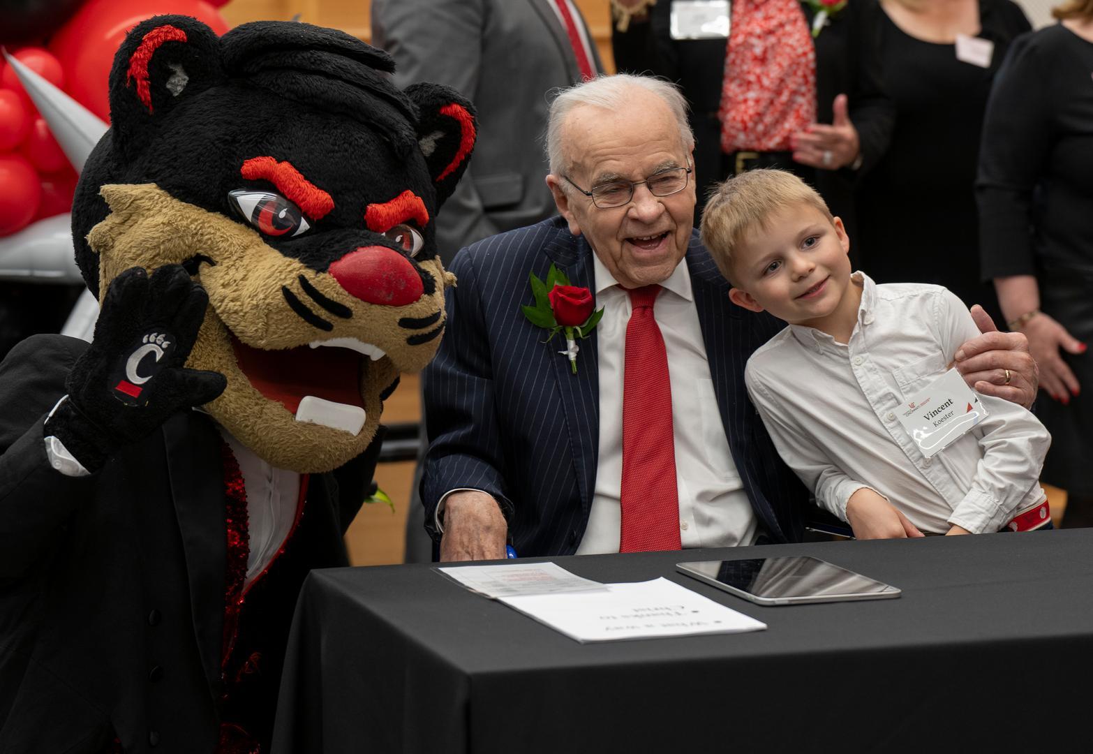 Donald Klekamp and family pose with the UC Bearcat.