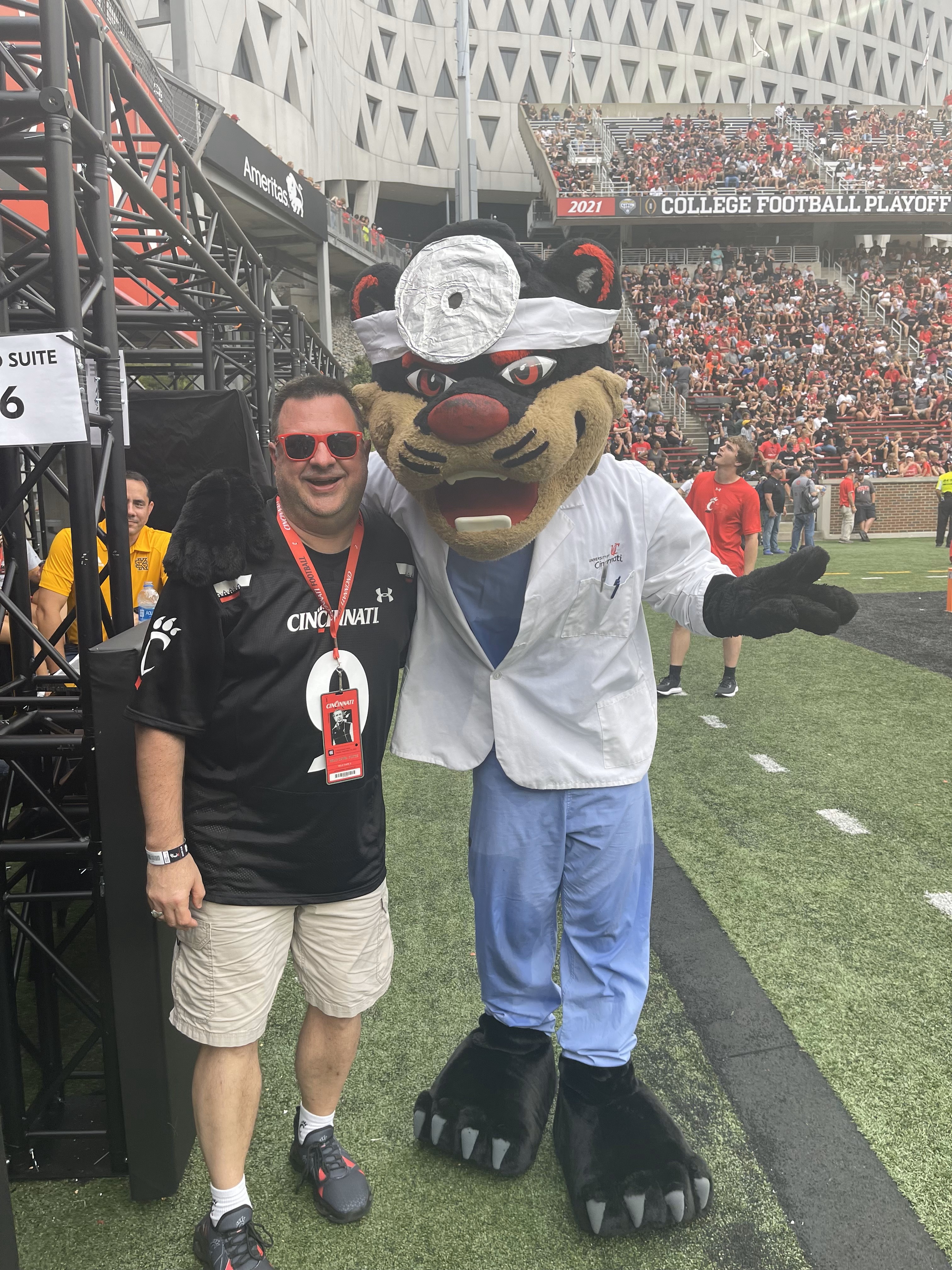 Peltier and Bearcat on football field