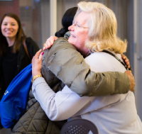 Two people hugging.