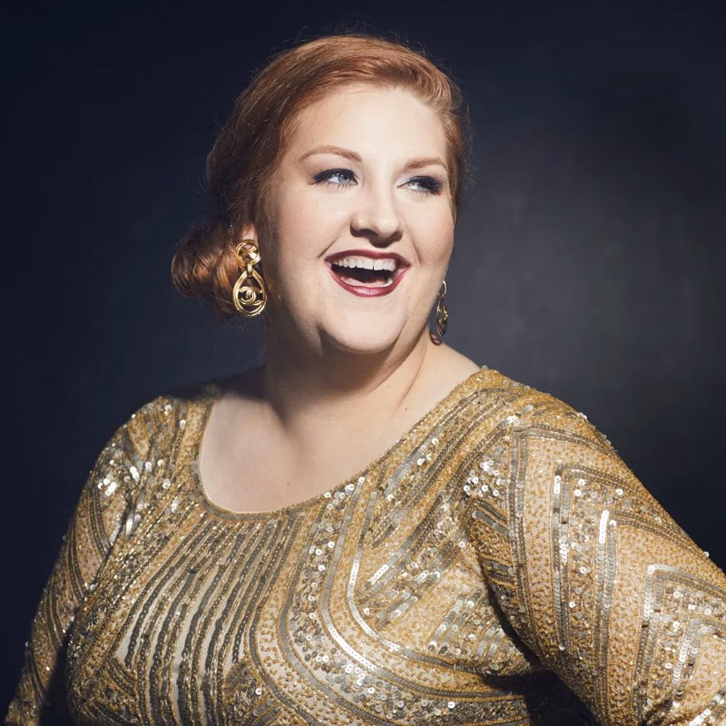 Tamara Wilson smiling in a gold shirt.