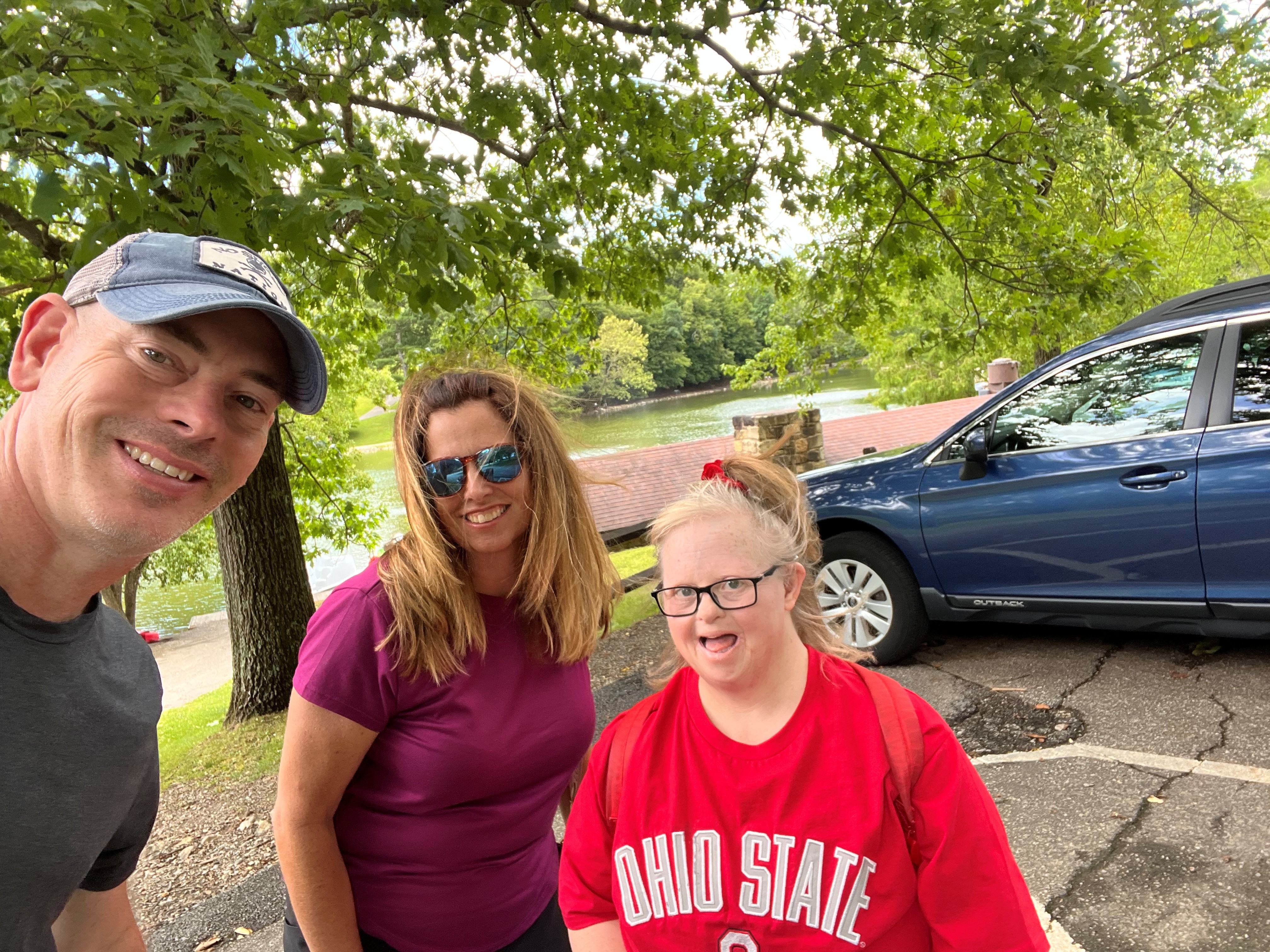 Three people smiling
